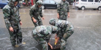 连续强降雨致路面积水 浙江消防冒雨为民排水 - 消防网